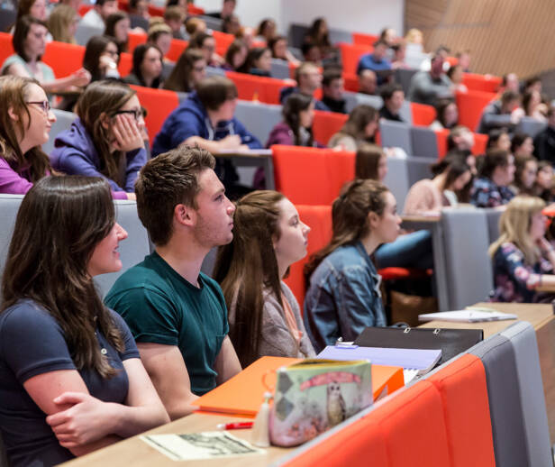 Students in a lecture listening and learning