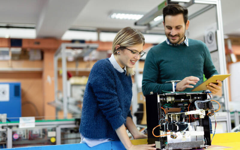 Two people working on an engineering project